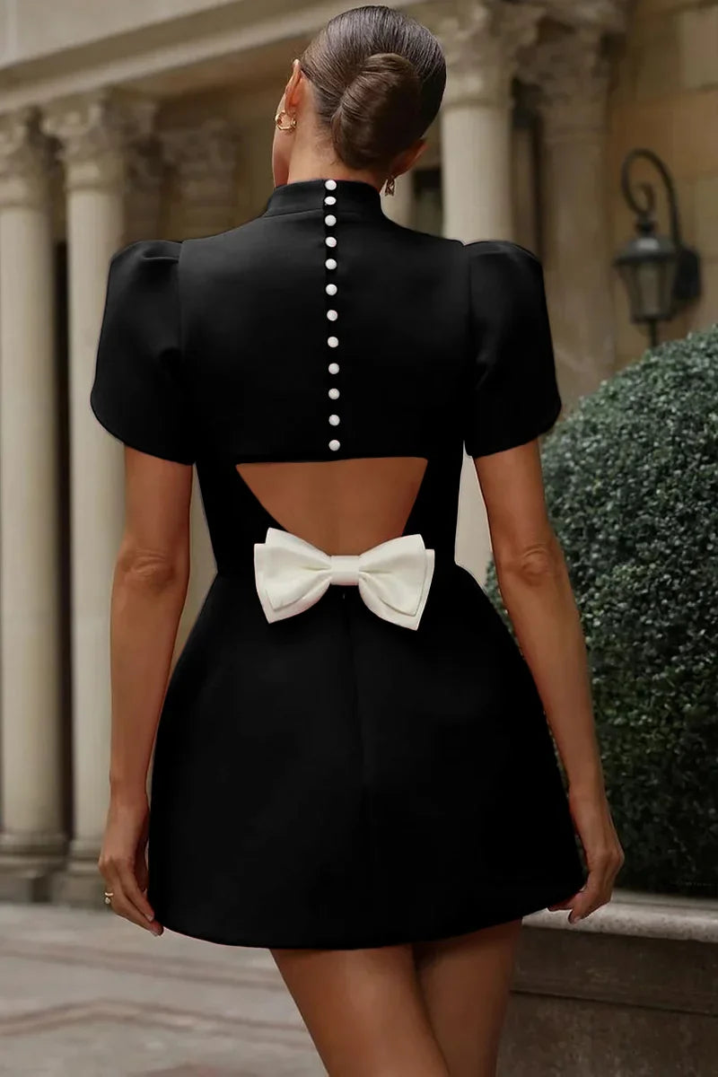 The Swiss Bow Button Dress