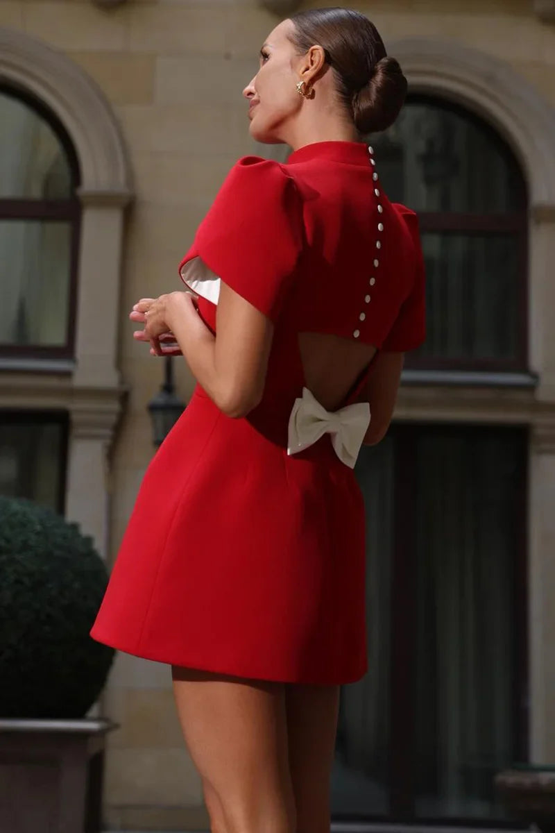 The Swiss Bow Button Dress